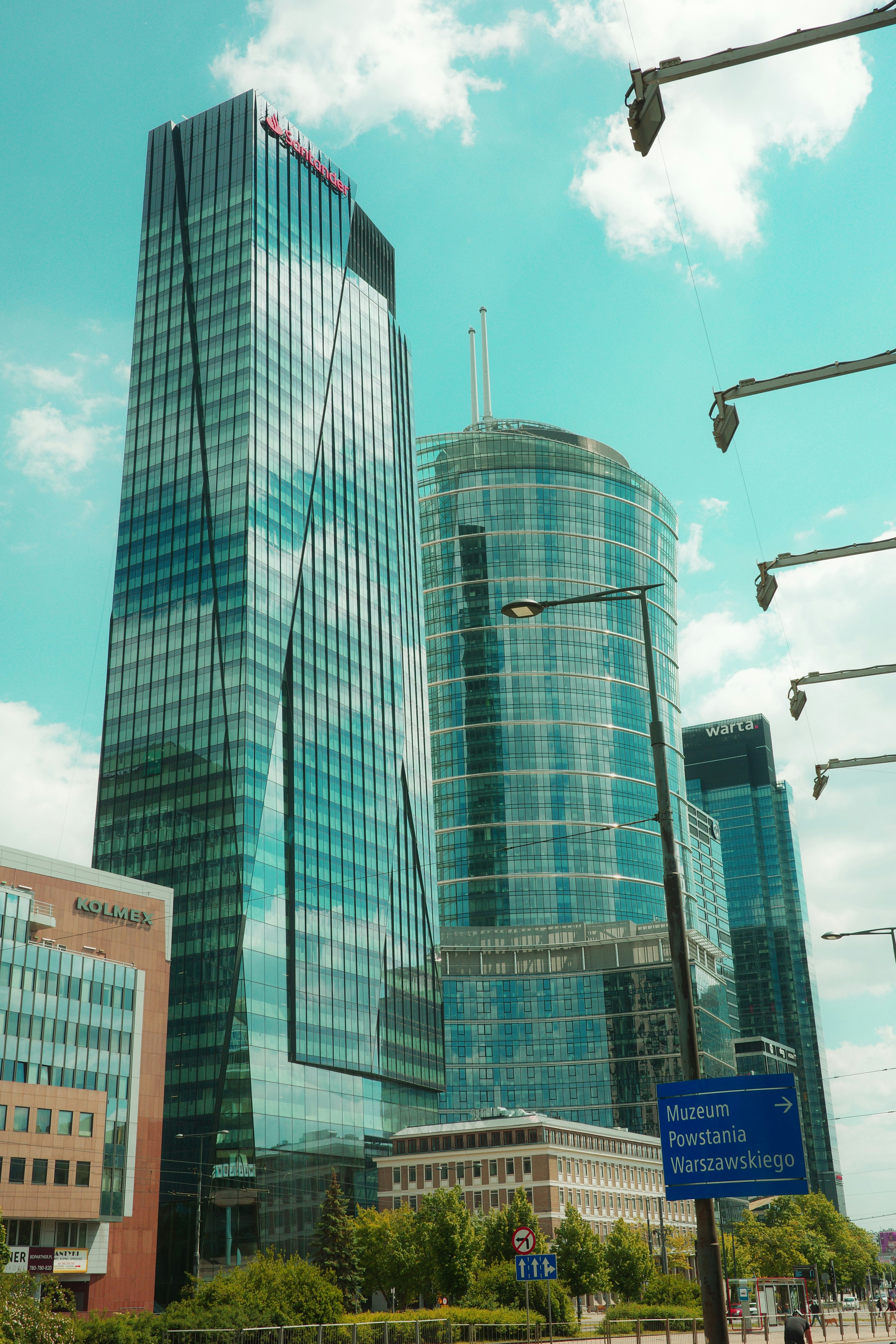 Warsaw Poland real estate for sale showing modern business district with glass office buildings and Vistula River